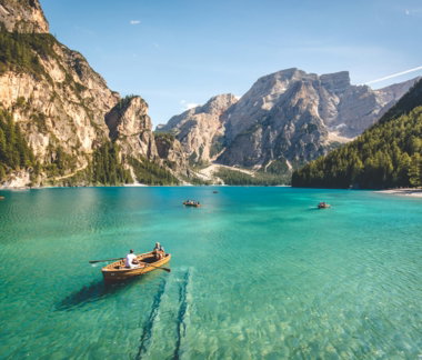 three-brown-wooden-boat-on-blue-lake-water-taken-at-daytime.jpg three brown wooden boat on blue lake water taken at daytime